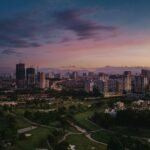 an aerial view of a city at sunset